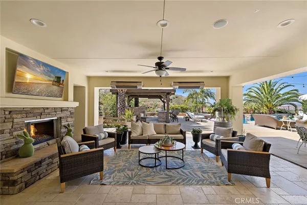a view of a patio with a table and chairs