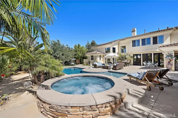a view of a swimming pool with a patio
