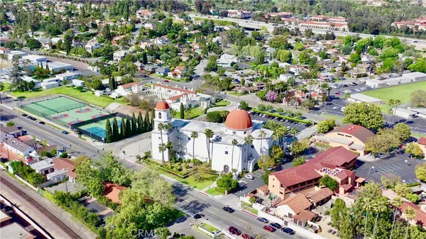 a view of a city with mountains in the background