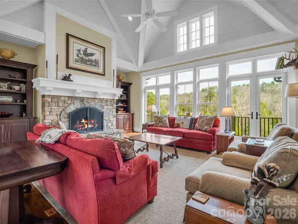 a living room with furniture fireplace and window