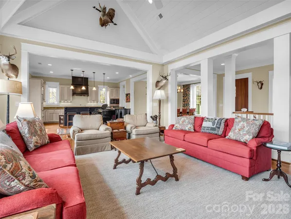 a kitchen with stainless steel appliances granite countertop a stove a sink and a wooden floors