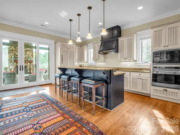 a kitchen with stainless steel appliances granite countertop a stove and a sink