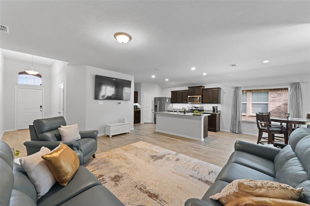 9020 Ridgeriver Way Fort Worth, TX 76131 - Photo 7 of 26 a living room with furniture and kitchen view