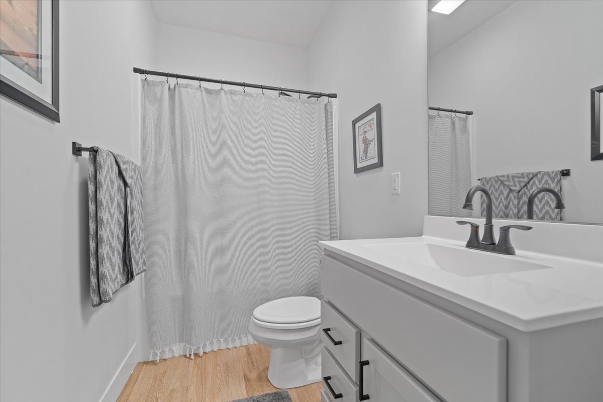1911 Glenbridge Road Bloomington, IL 61704 - Photo 18 of 36 a bathroom with a sink toilet and vanity