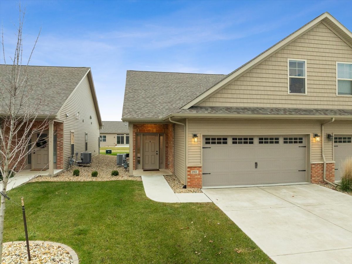 1911 Glenbridge Road Bloomington, IL 61704 - Photo 2 of 36 a front view of house with outdoor seating