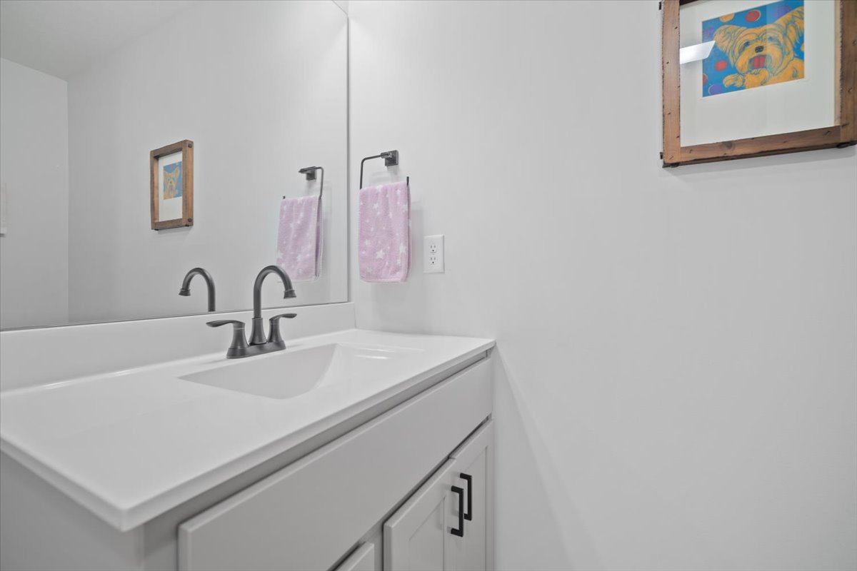 1911 Glenbridge Road Bloomington, IL 61704 - Photo 22 of 36 a bathroom with a sink and a mirror