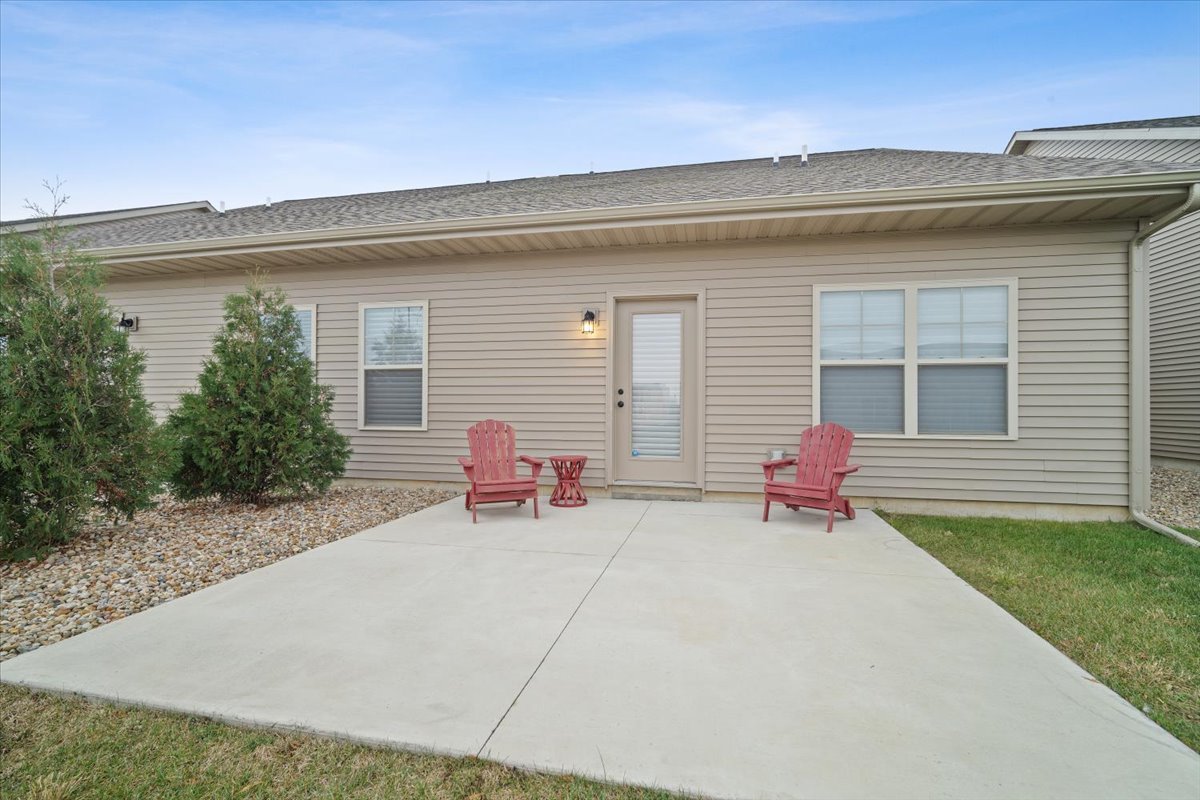 1911 Glenbridge Road Bloomington, IL 61704 - Photo 26 of 36 a view of a house with a patio and a yard