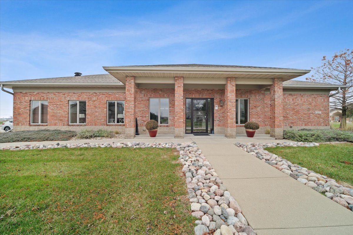 1911 Glenbridge Road Bloomington, IL 61704 - Photo 30 of 36 a front view of a house with a garden and patio