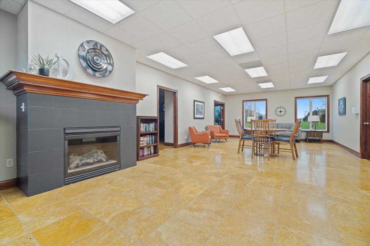 1911 Glenbridge Road Bloomington, IL 61704 - Photo 36 of 36 a living room with furniture and a fireplace