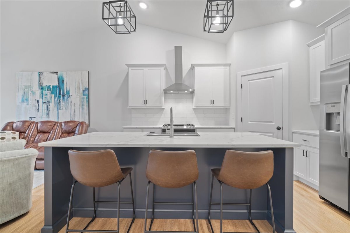 1911 Glenbridge Road Bloomington, IL 61704 - Photo 6 of 36 a kitchen with stainless steel appliances a sink and chairs