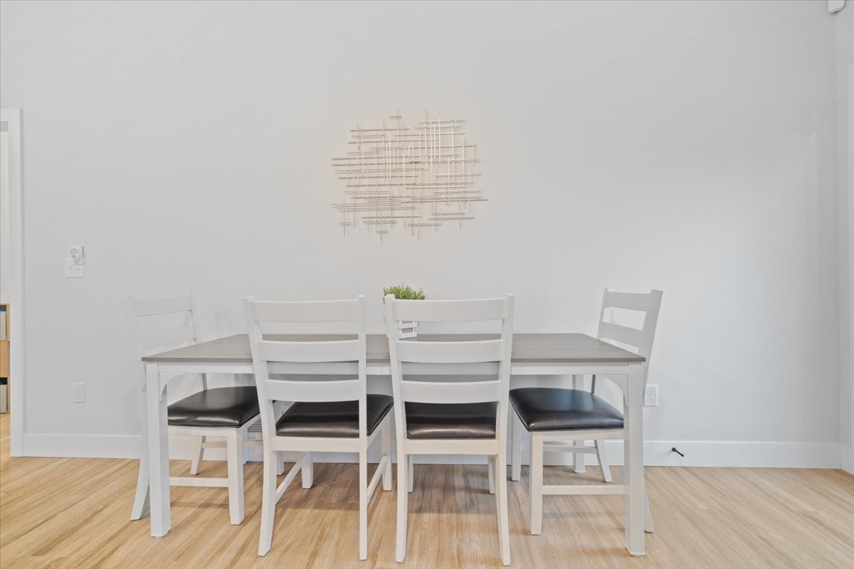 1911 Glenbridge Road Bloomington, IL 61704 - Photo 10 of 36 a view of a dining room with furniture and wooden floor