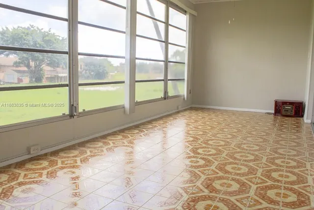 a view of an empty room and window
