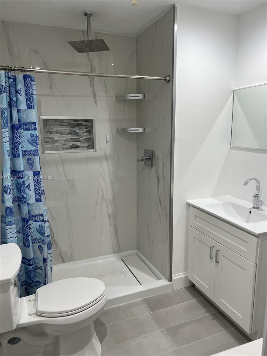 20927 Sedgewick Drive Boca Raton, FL 33433 - Photo 15 of 24 a bathroom with a toilet and a sink