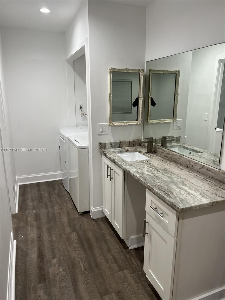 20927 Sedgewick Drive Boca Raton, FL 33433 - Photo 16 of 24 a bathroom with a sink and a mirror