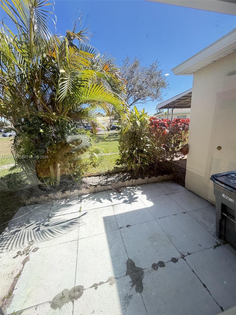 20927 Sedgewick Drive Boca Raton, FL 33433 - Photo 23 of 24 a view of a pathway both side of building