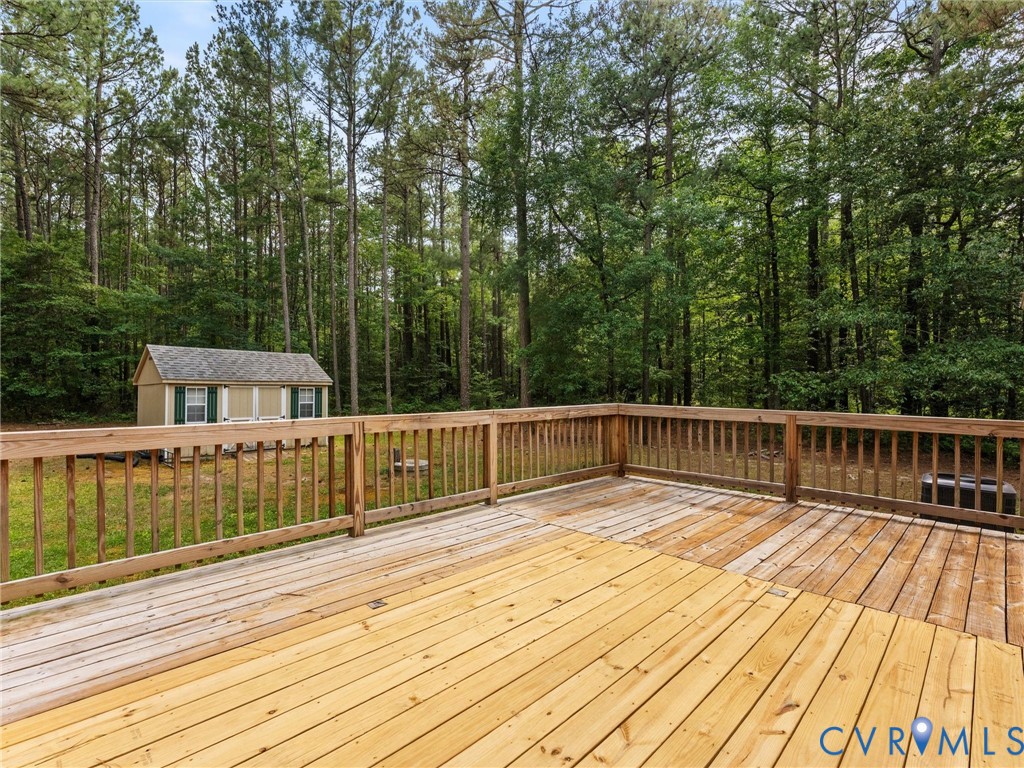 14175 Lebanon Road Disputanta, VA 23842 - Photo 42 of 60 Spacious outdoor wood deck with natural wood raili