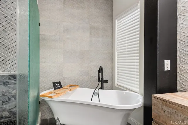 a bedroom with a bed and a view of kitchen