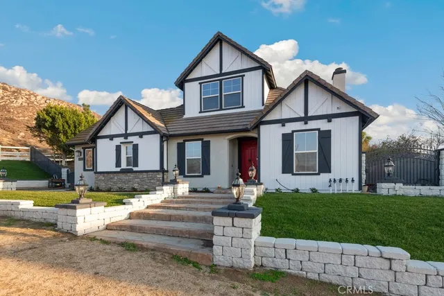 a front view of a house with garden