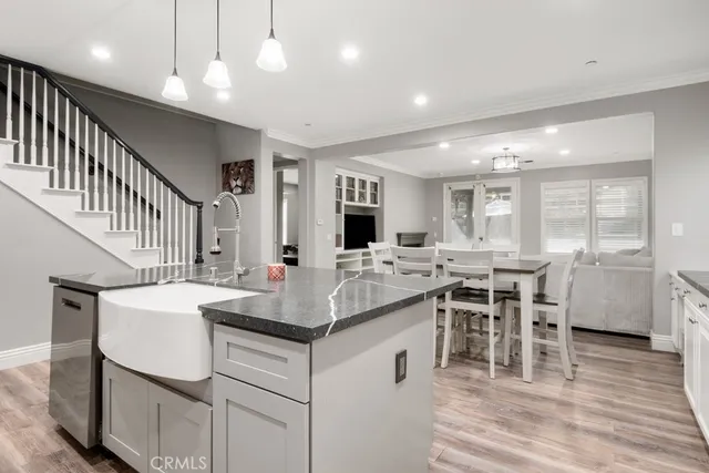 a view of kitchen with cabinets and wooden floor