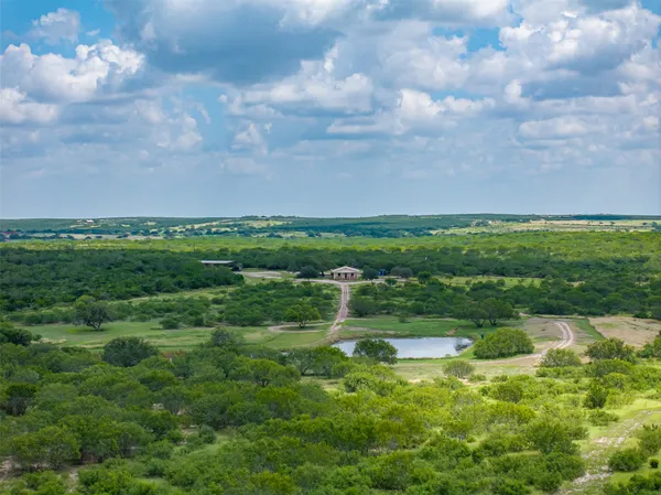 a view of a lake with green space