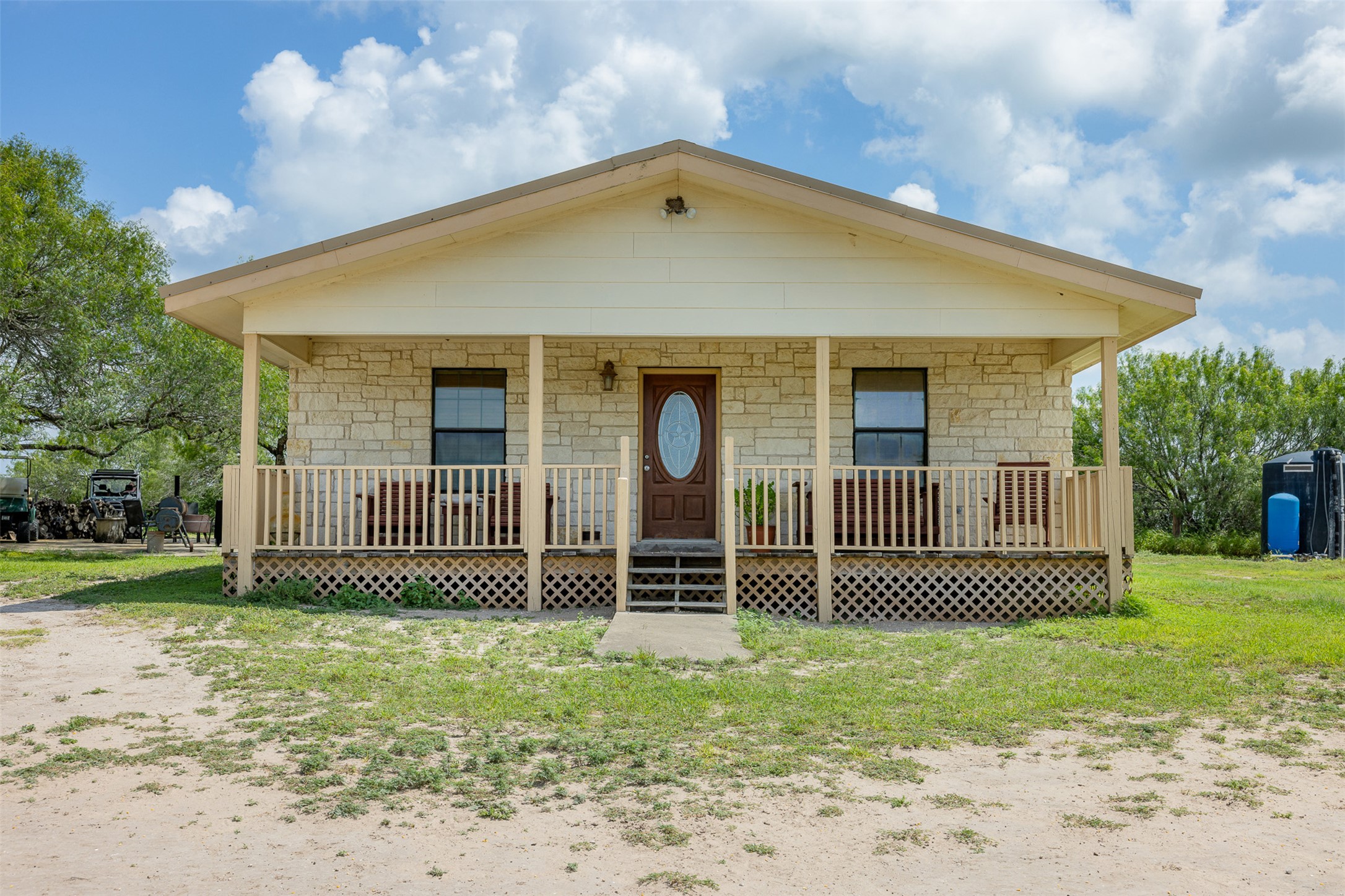 817 Highway 59 George West, TX 78022 - Photo 20 of 40 a front view of a house with a garden