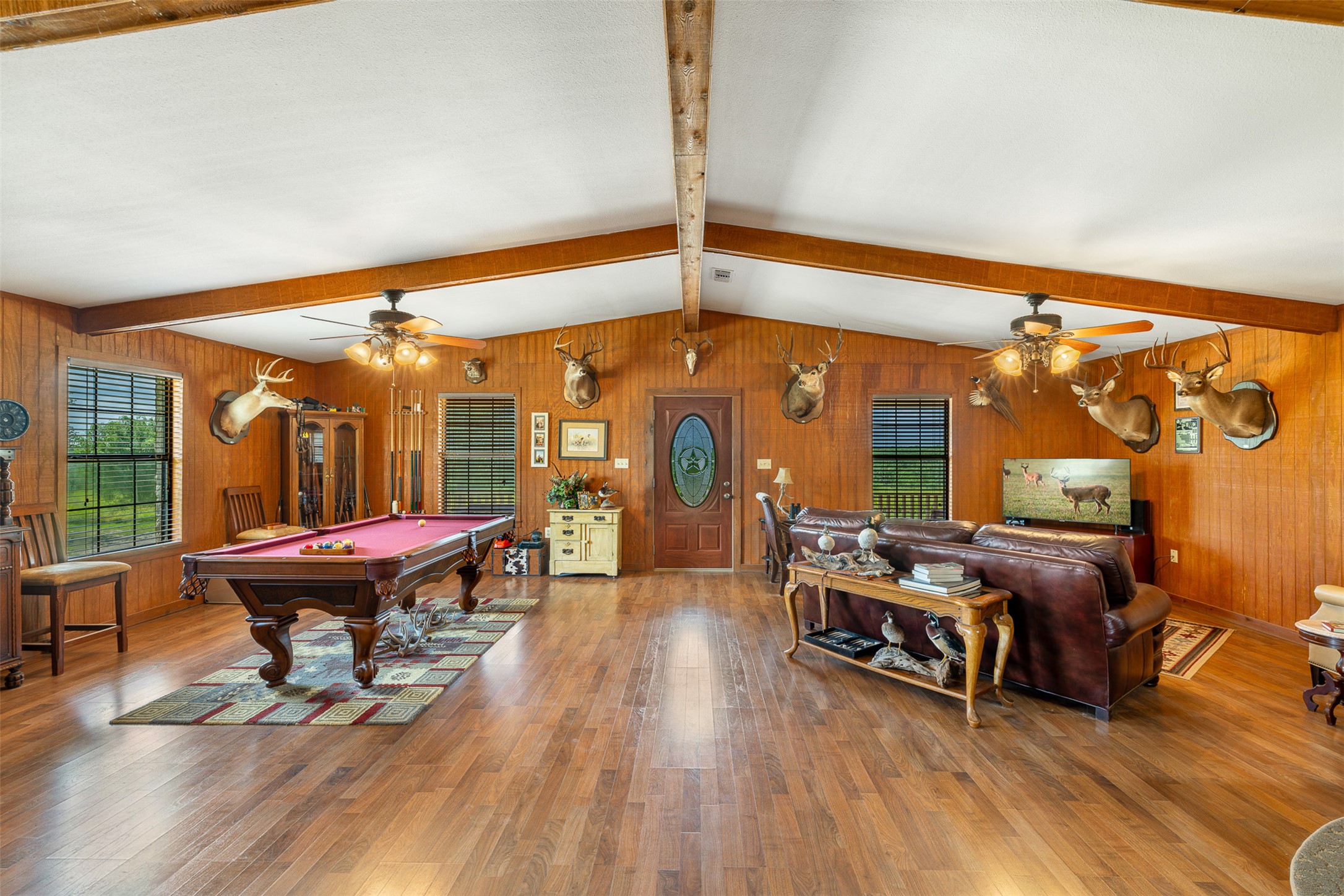 817 Highway 59 George West, TX 78022 - Photo 23 of 40 a living room with furniture a wooden floor and a large window