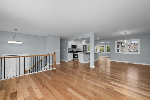 a view of kitchen with furniture and wooden floor