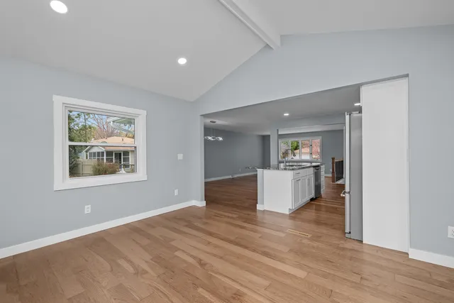 a view of kitchen with furniture and wooden floor