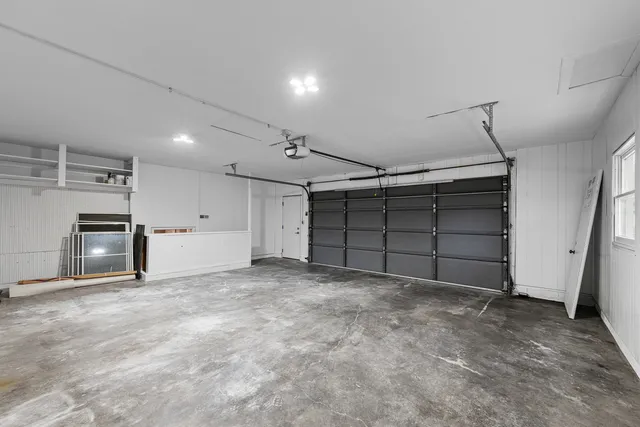 a view of an empty room with a fireplace