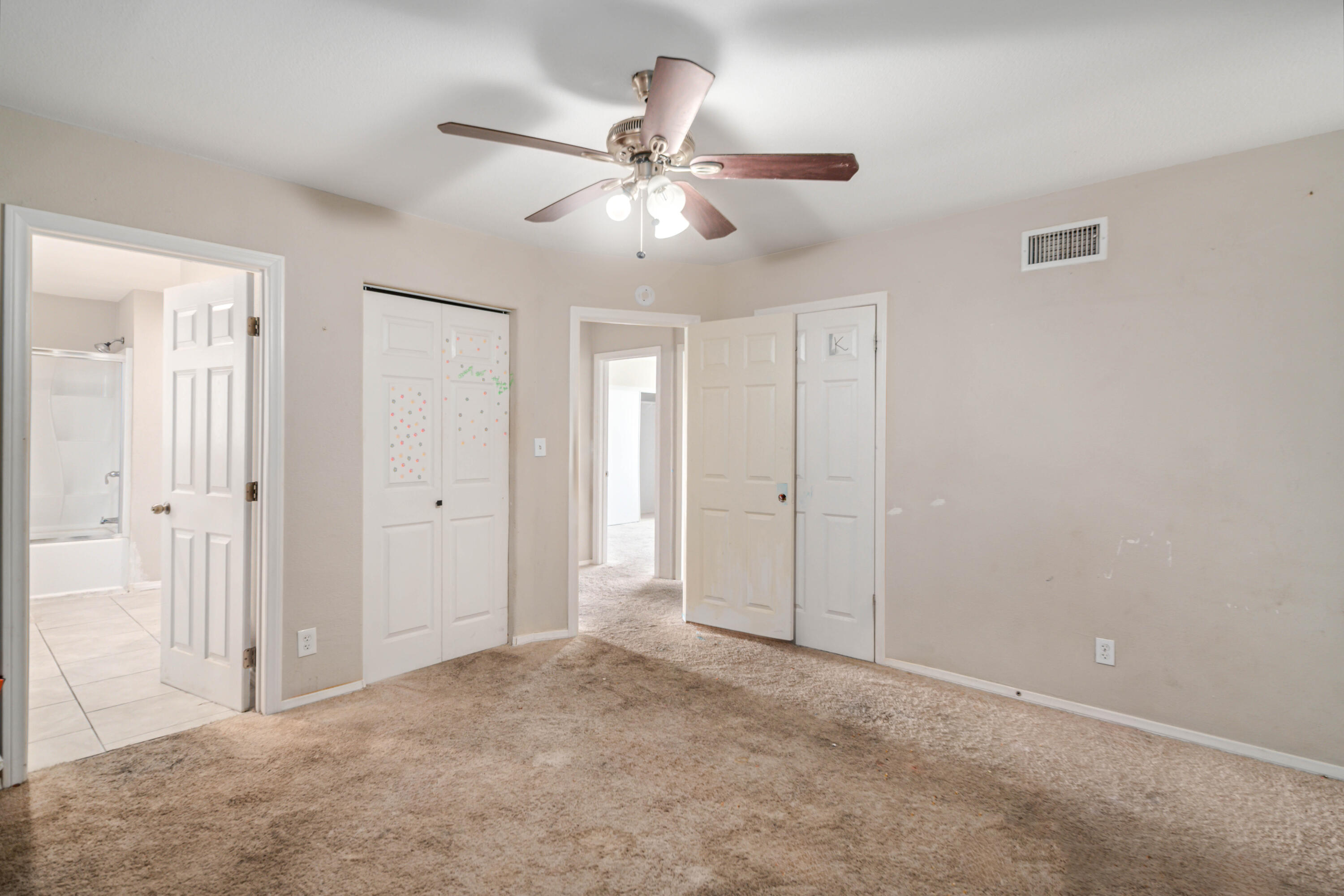621 Ave J E Lancaster Ca East Lancaster, CA 93535 - Photo 16 of 25 a view of an empty room and chandelier fan