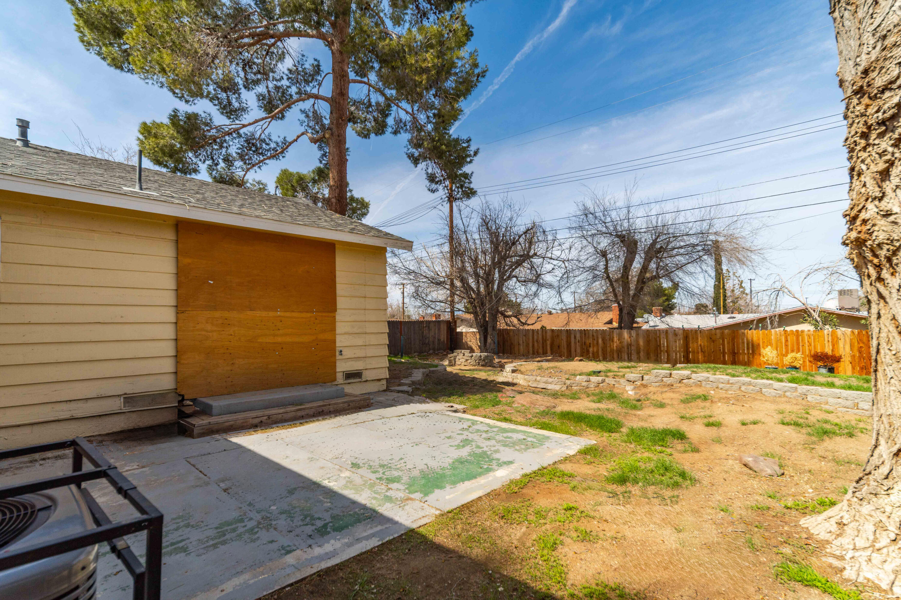 621 Ave J E Lancaster Ca East Lancaster, CA 93535 - Photo 22 of 25 a view of a backyard of the house