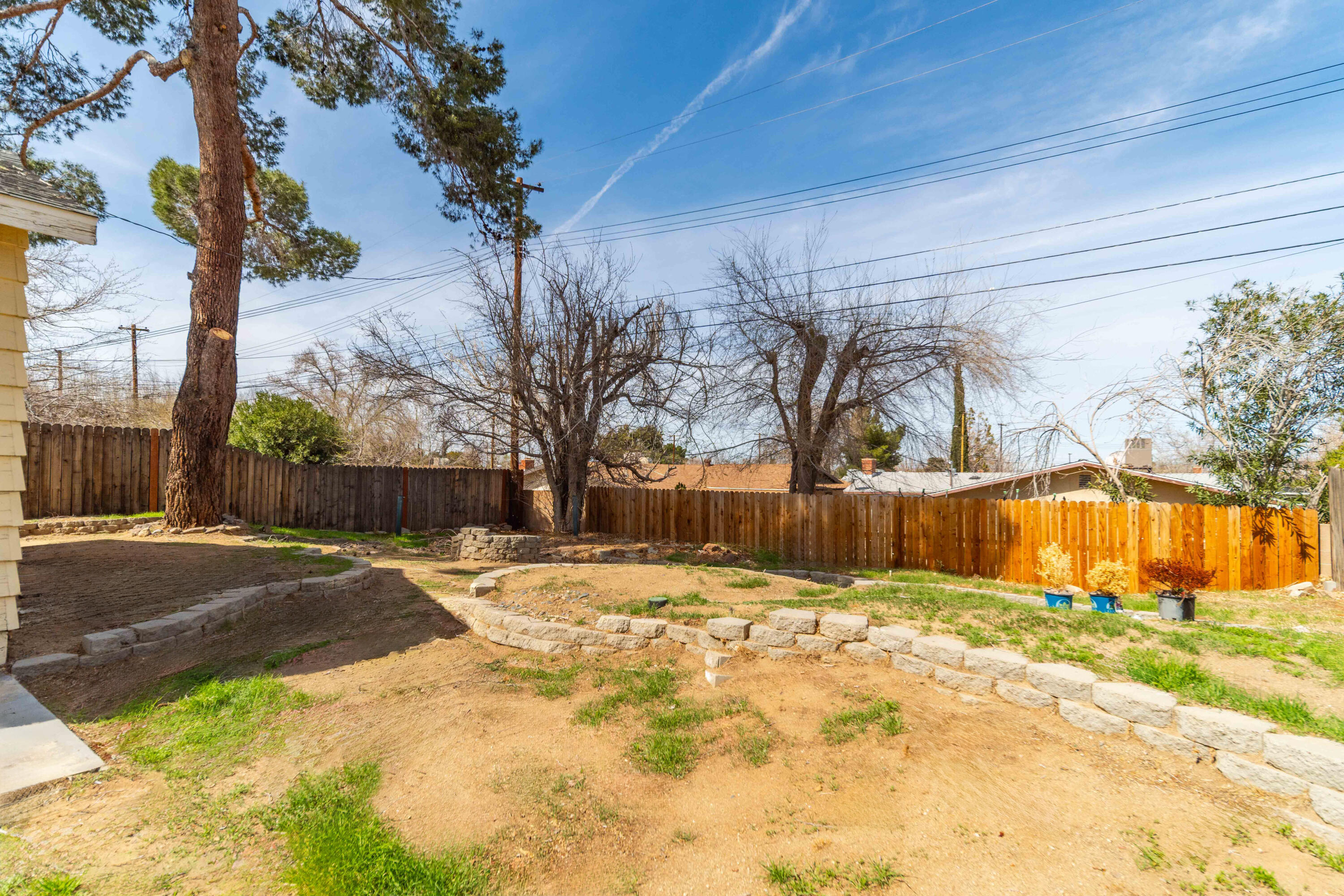 621 Ave J E Lancaster Ca East Lancaster, CA 93535 - Photo 24 of 25 a view of backyard with swimming pool
