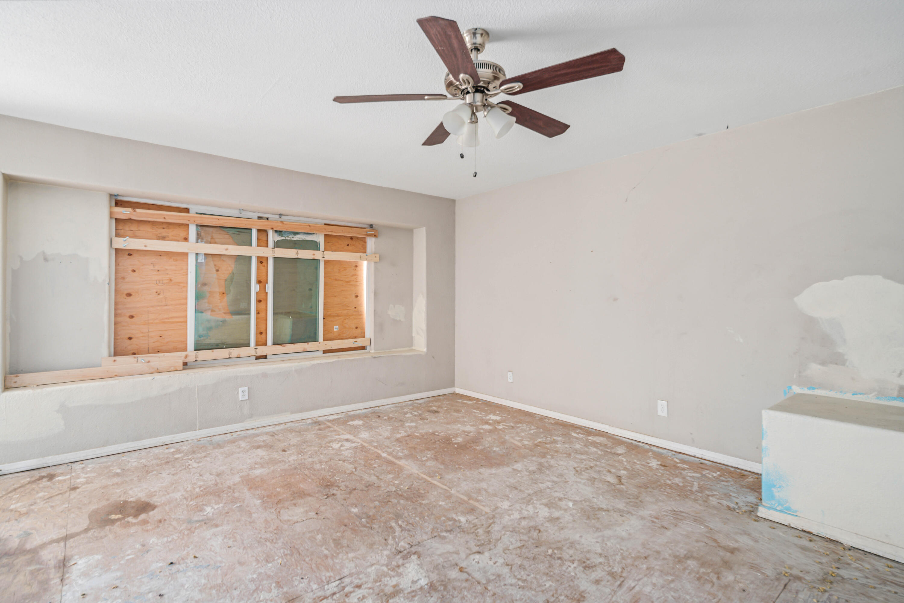 621 Ave J E Lancaster Ca East Lancaster, CA 93535 - Photo 7 of 25 a view of an empty room with a window