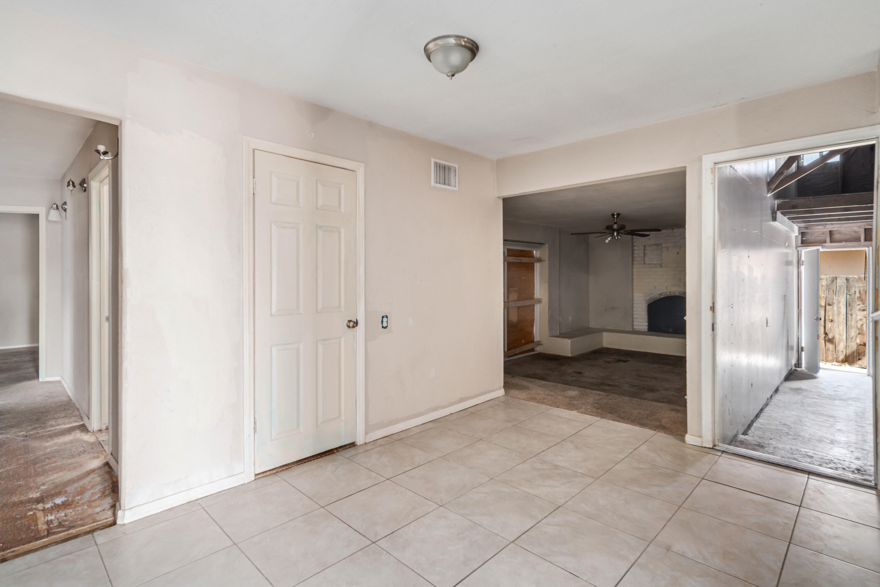 621 Ave J E Lancaster Ca East Lancaster, CA 93535 - Photo 9 of 25 a view of a hallway with wooden shelves