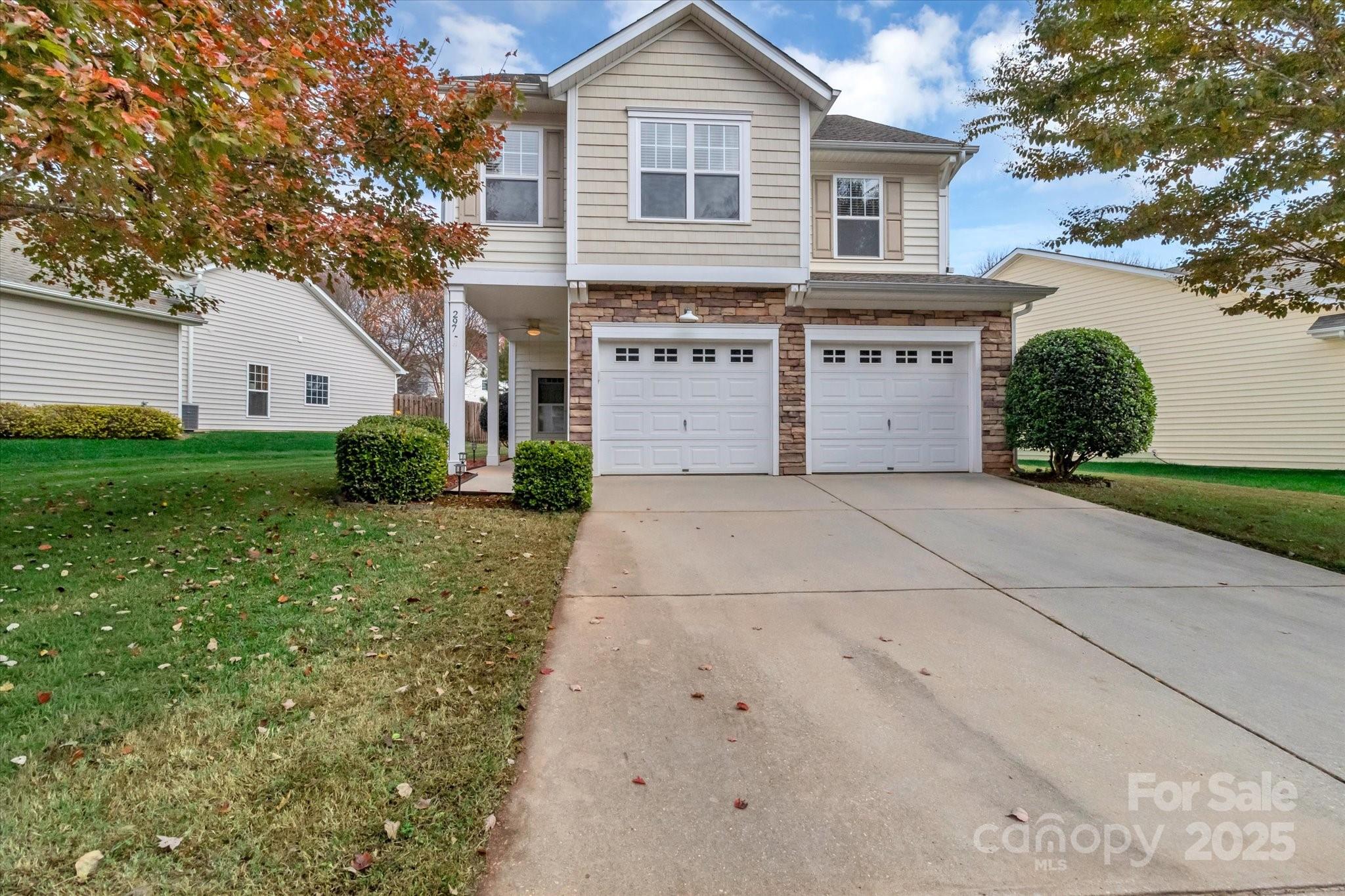 297 Sand Paver Way Fort Mill, SC 29708 - Photo 2 of 39 a front view of a house with a yard and trees