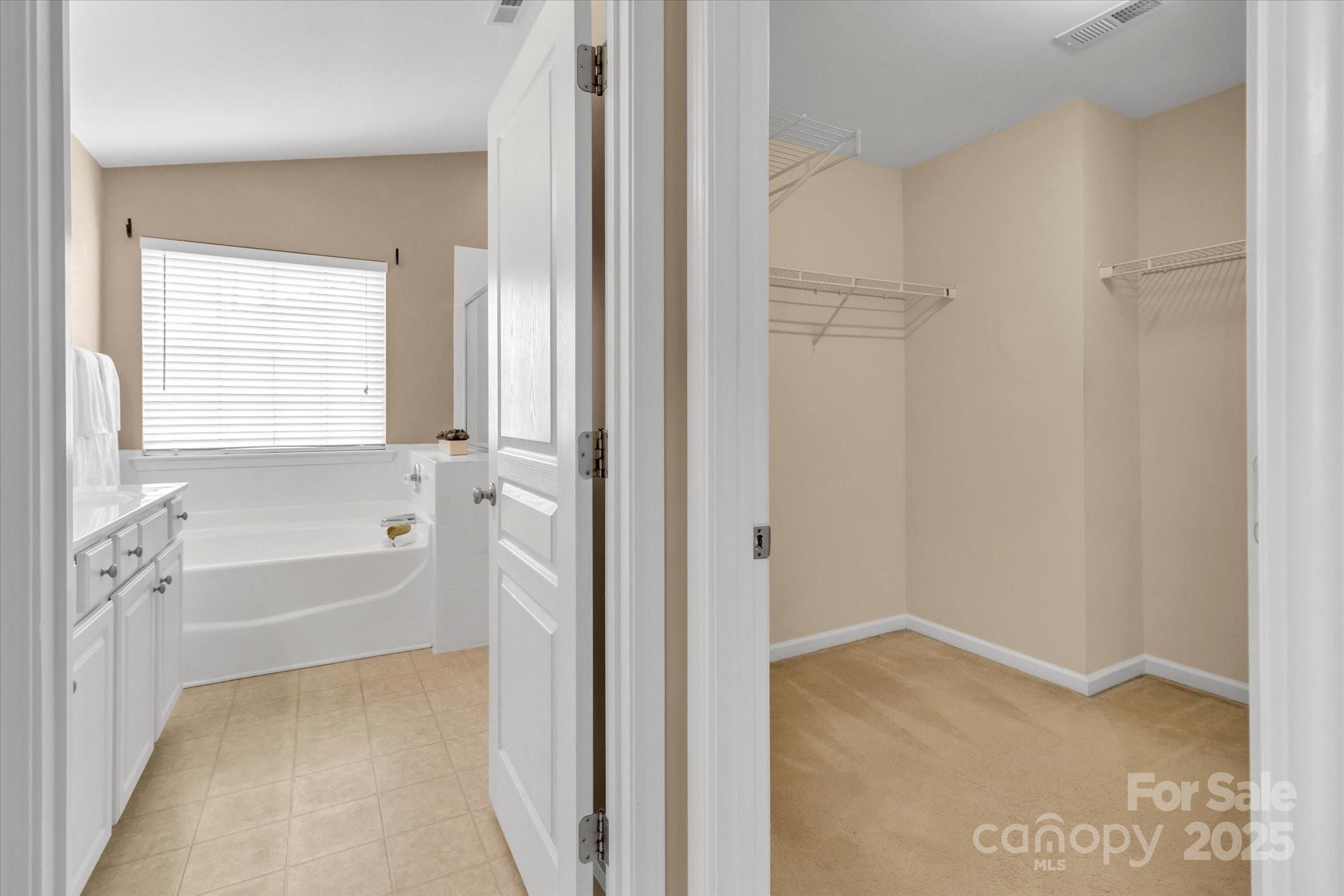 297 Sand Paver Way Fort Mill, SC 29708 - Photo 25 of 39 a bathroom with a bathtub and a shower