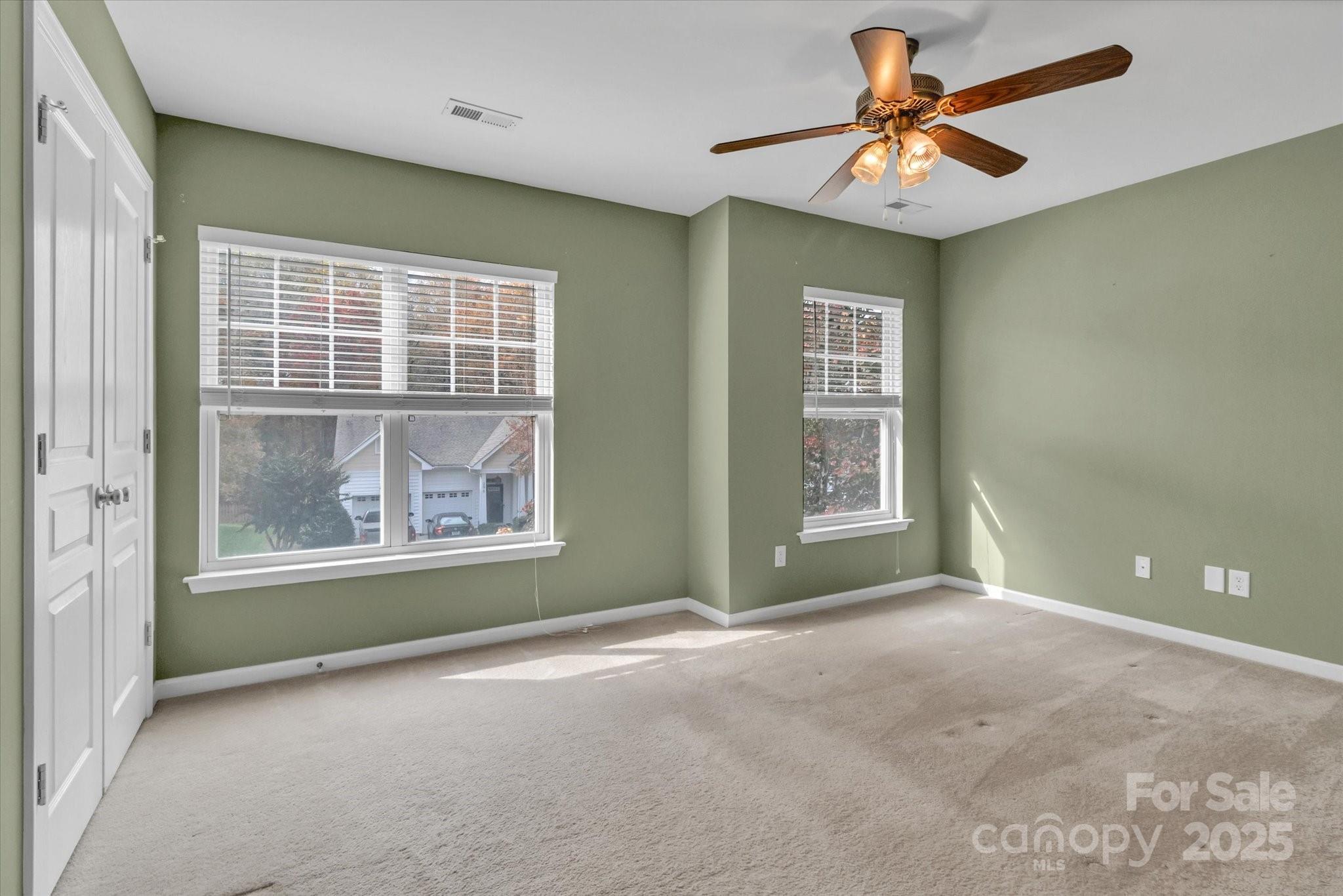 297 Sand Paver Way Fort Mill, SC 29708 - Photo 30 of 39 an empty room with windows and fan