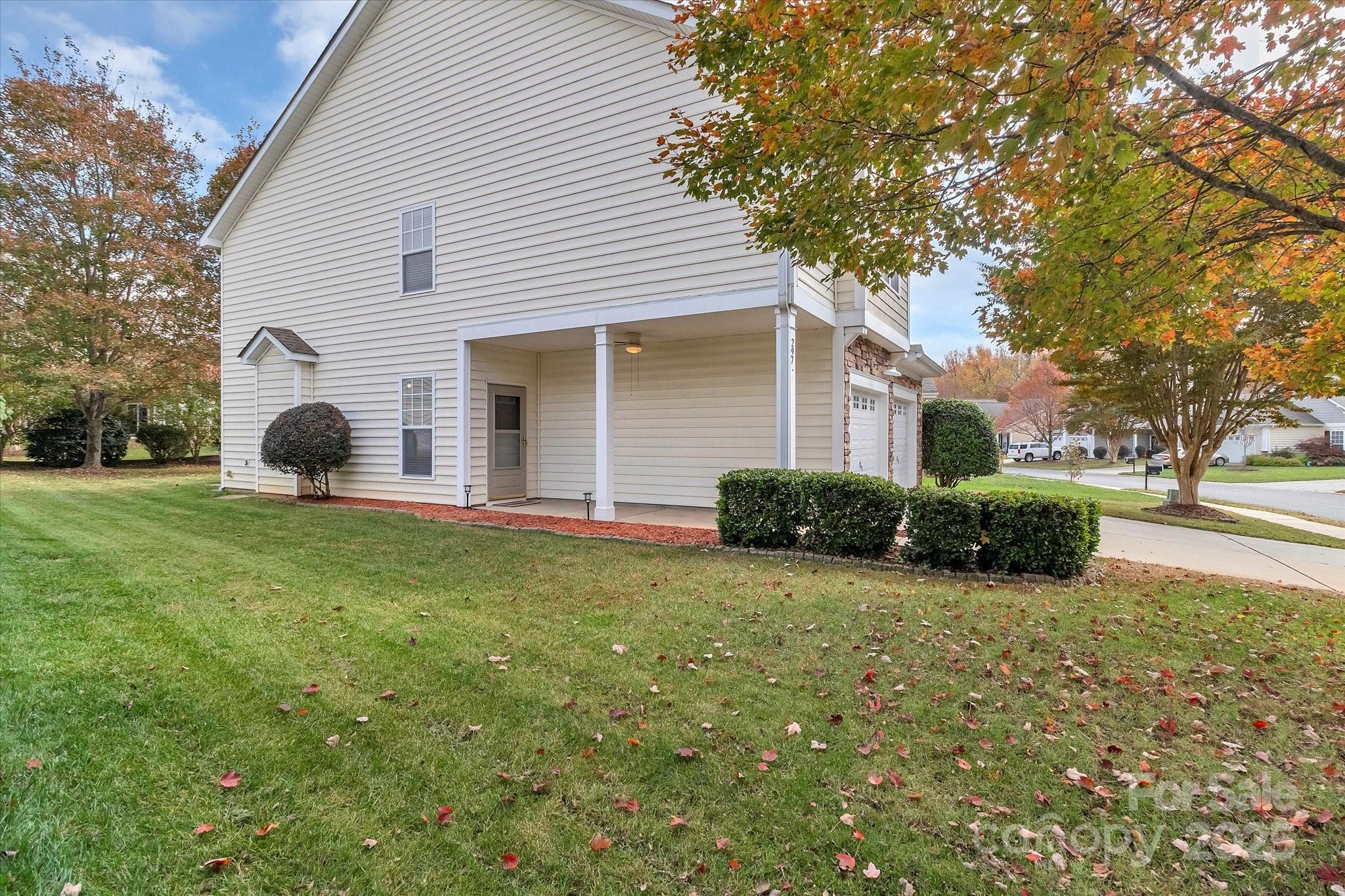 297 Sand Paver Way Fort Mill, SC 29708 - Photo 4 of 39 a view of a house with backyard and garden