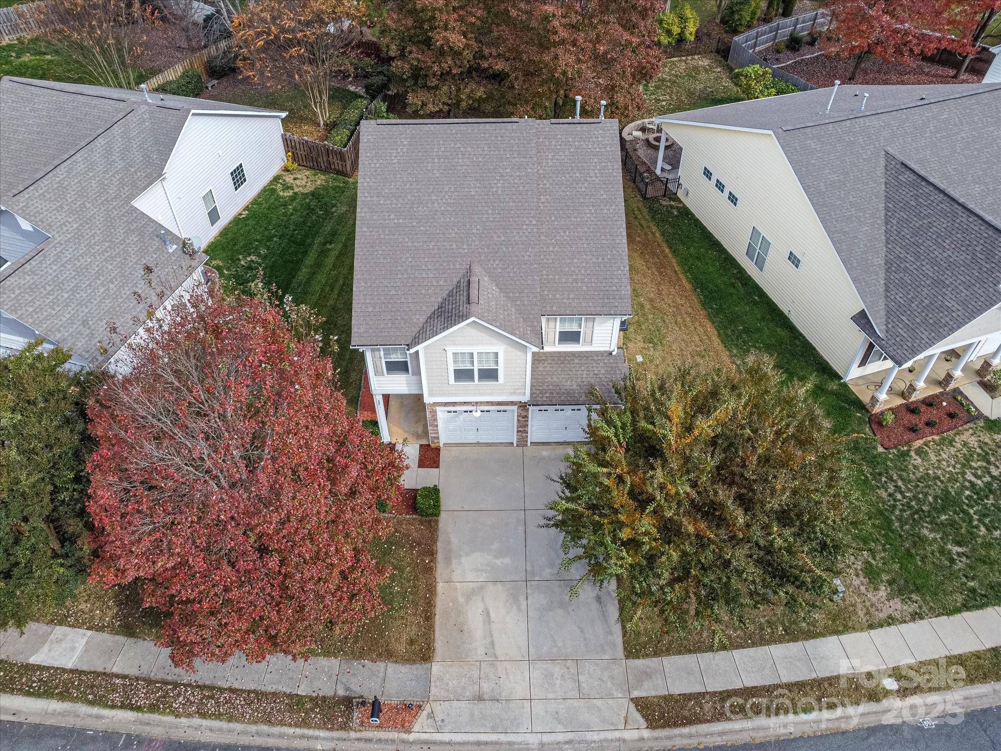 297 Sand Paver Way Fort Mill, SC 29708 - Photo 7 of 39 an aerial view of a house with a yard and large tree