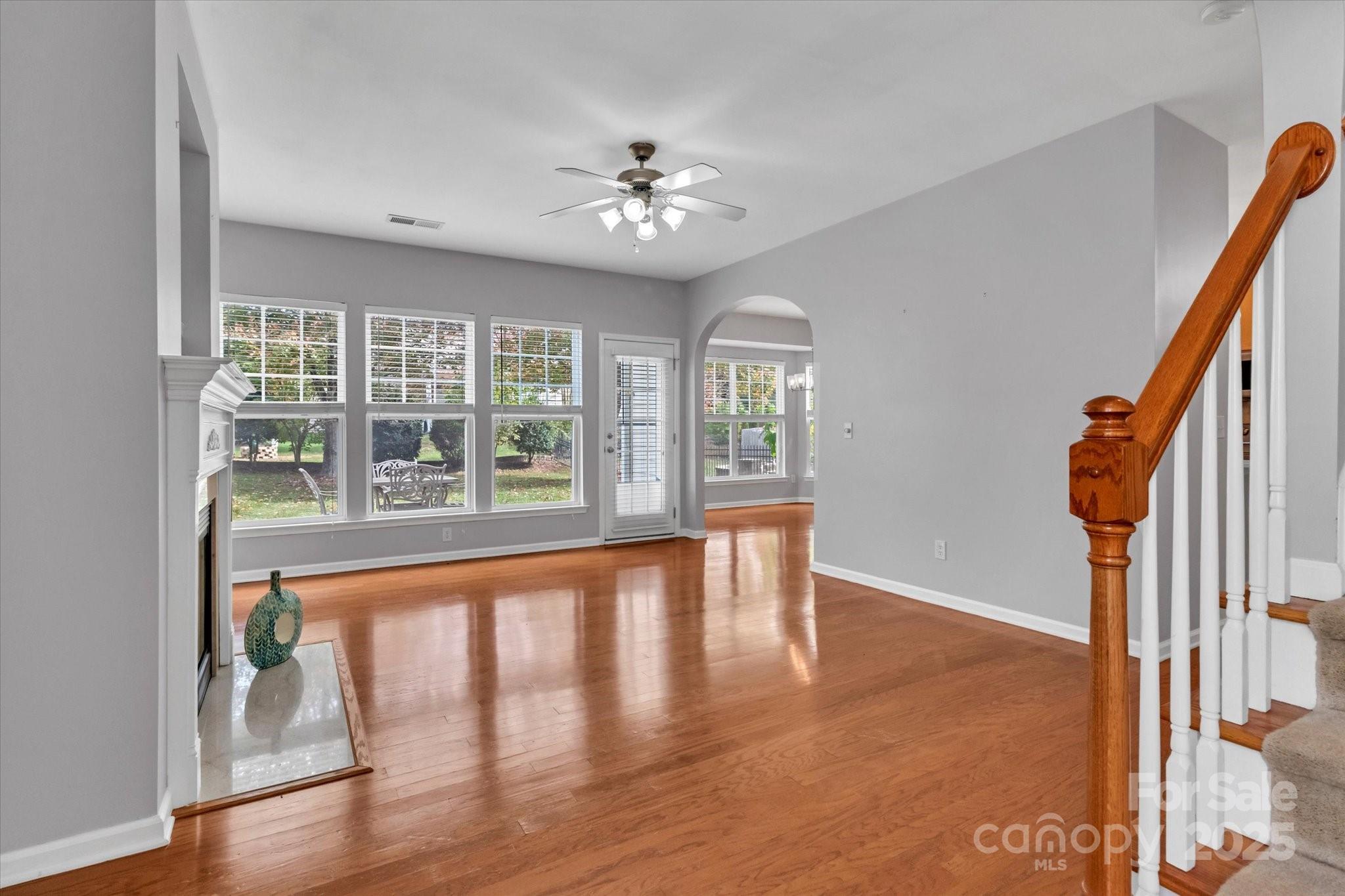 297 Sand Paver Way Fort Mill, SC 29708 - Photo 9 of 39 a view of an empty room with wooden floor and a window