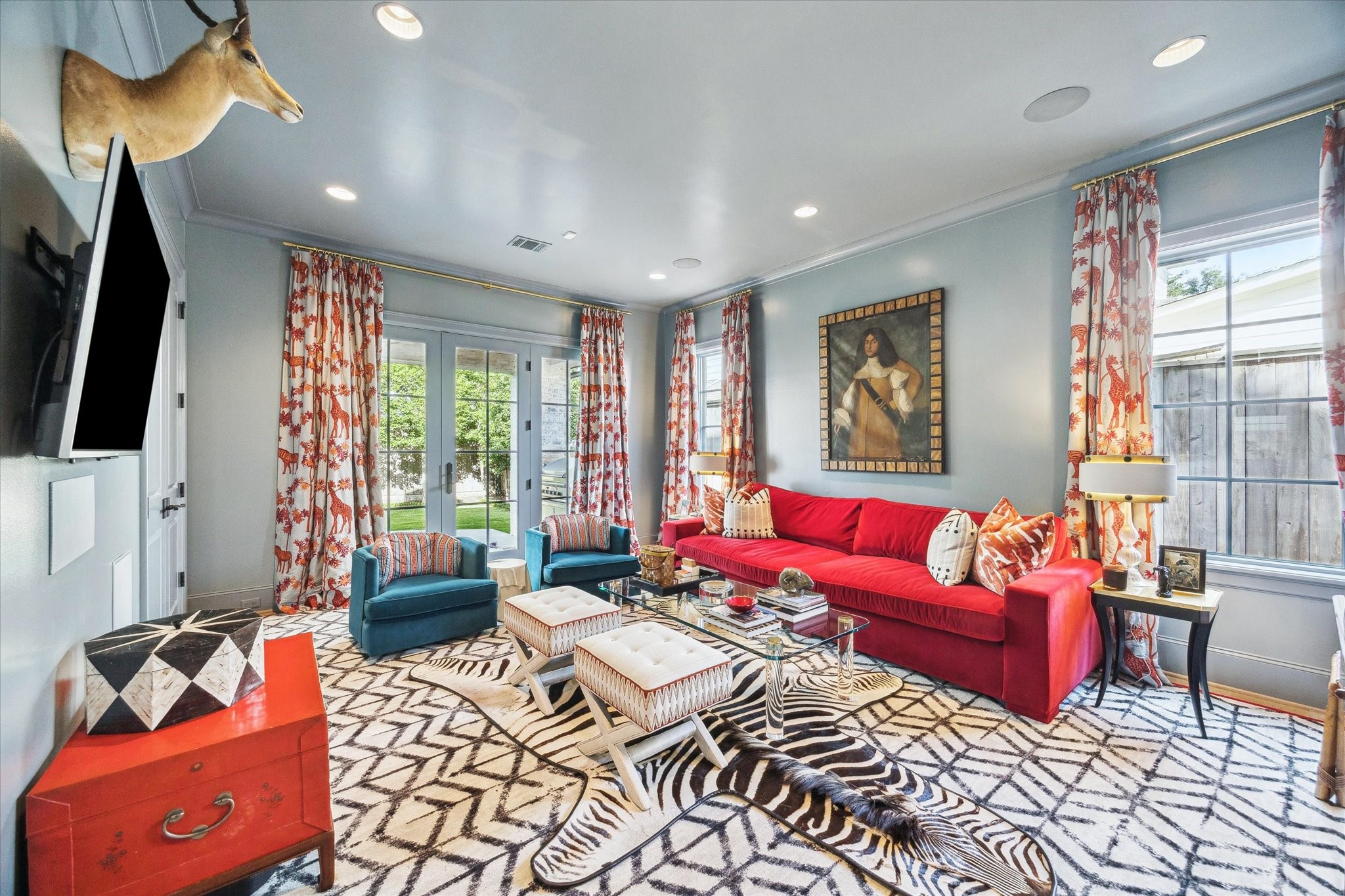 6218 Burgoyne Road Houston, TX 77057 - Photo 19 of 43 a living room with furniture a large window and a flat screen tv