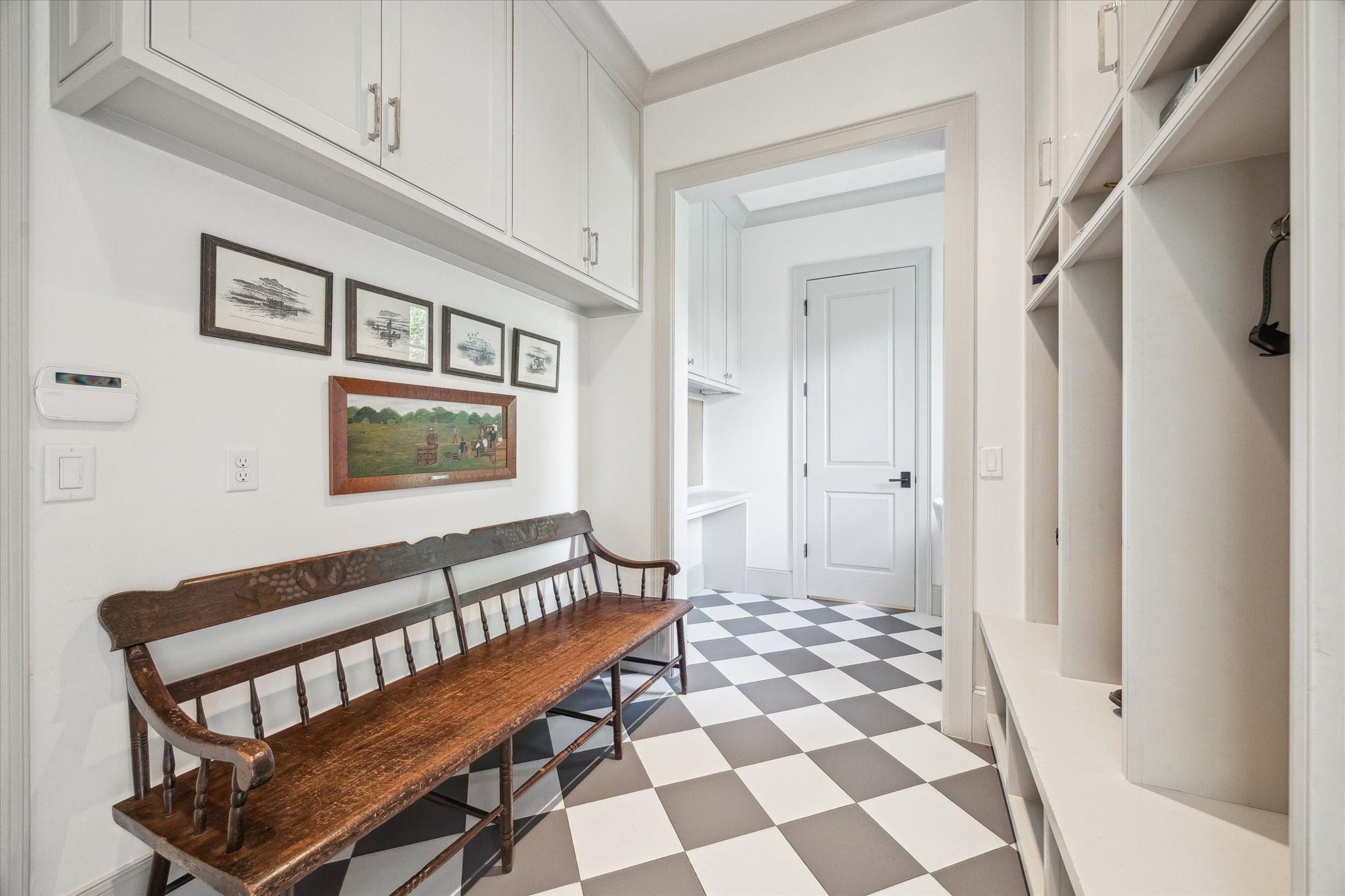 6218 Burgoyne Road Houston, TX 77057 - Photo 23 of 43 a view of a hallway with a black and white checkered floor