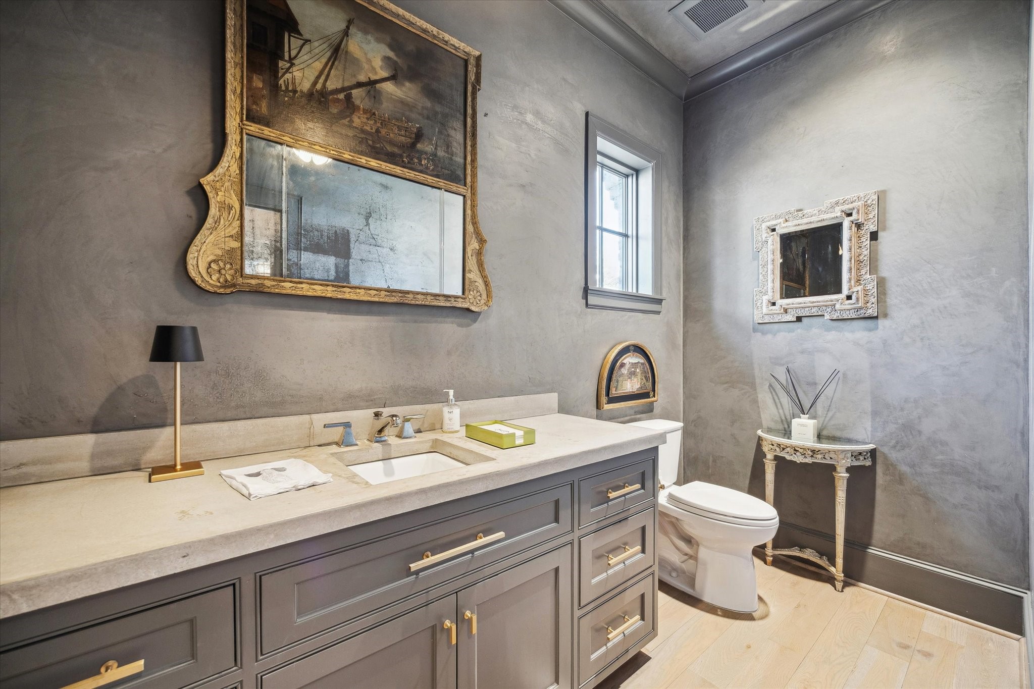 6218 Burgoyne Road Houston, TX 77057 - Photo 24 of 43 a bathroom with a toilet sink and mirror