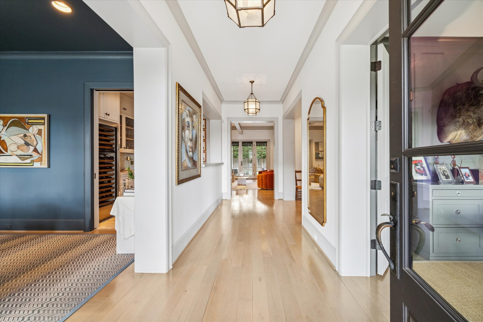 6218 Burgoyne Road Houston, TX 77057 - Photo 3 of 43 a view of a hallway with wooden floor and living room