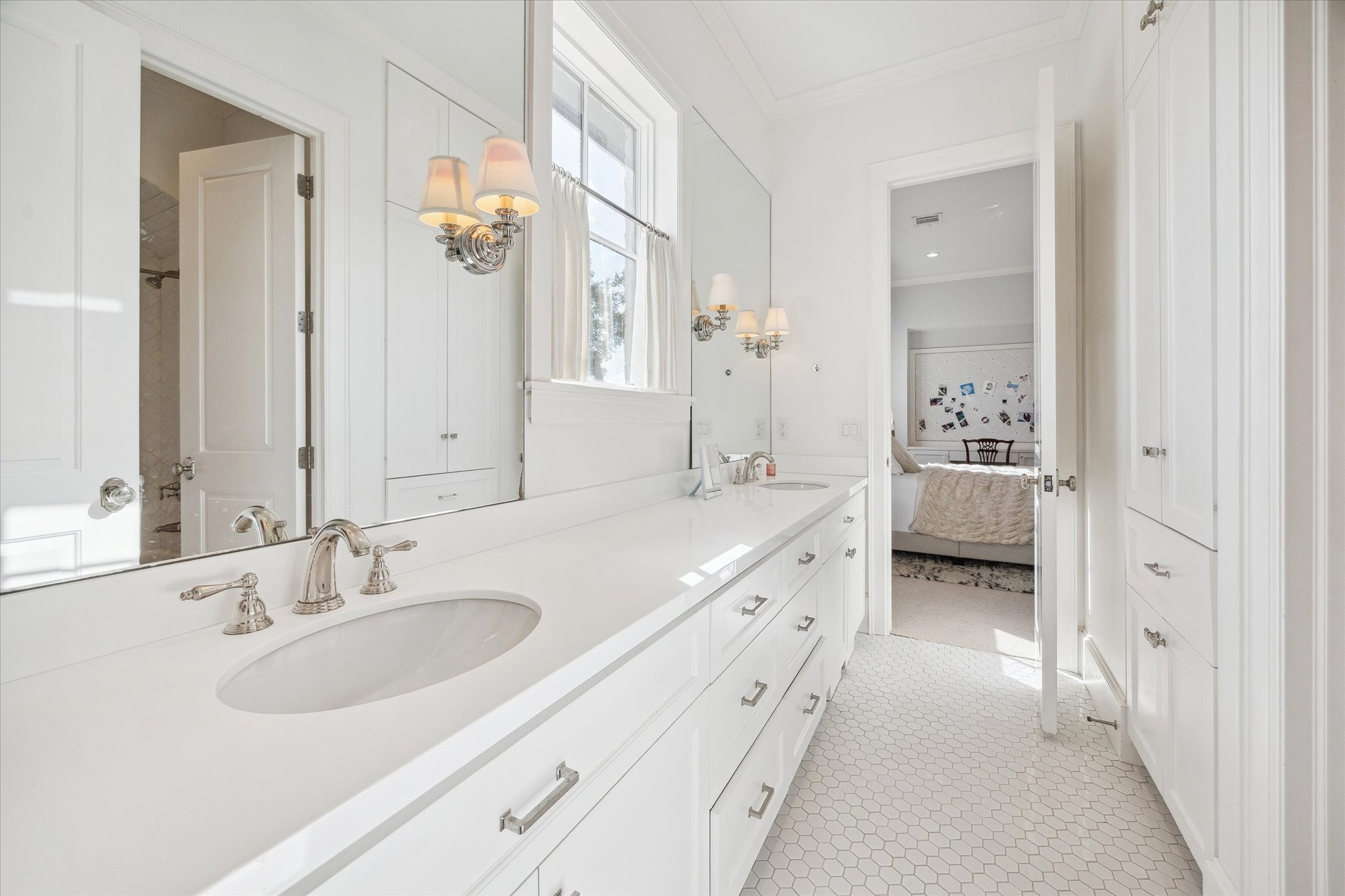 6218 Burgoyne Road Houston, TX 77057 - Photo 33 of 43 a spacious bathroom with a double vanity sink a mirror and a