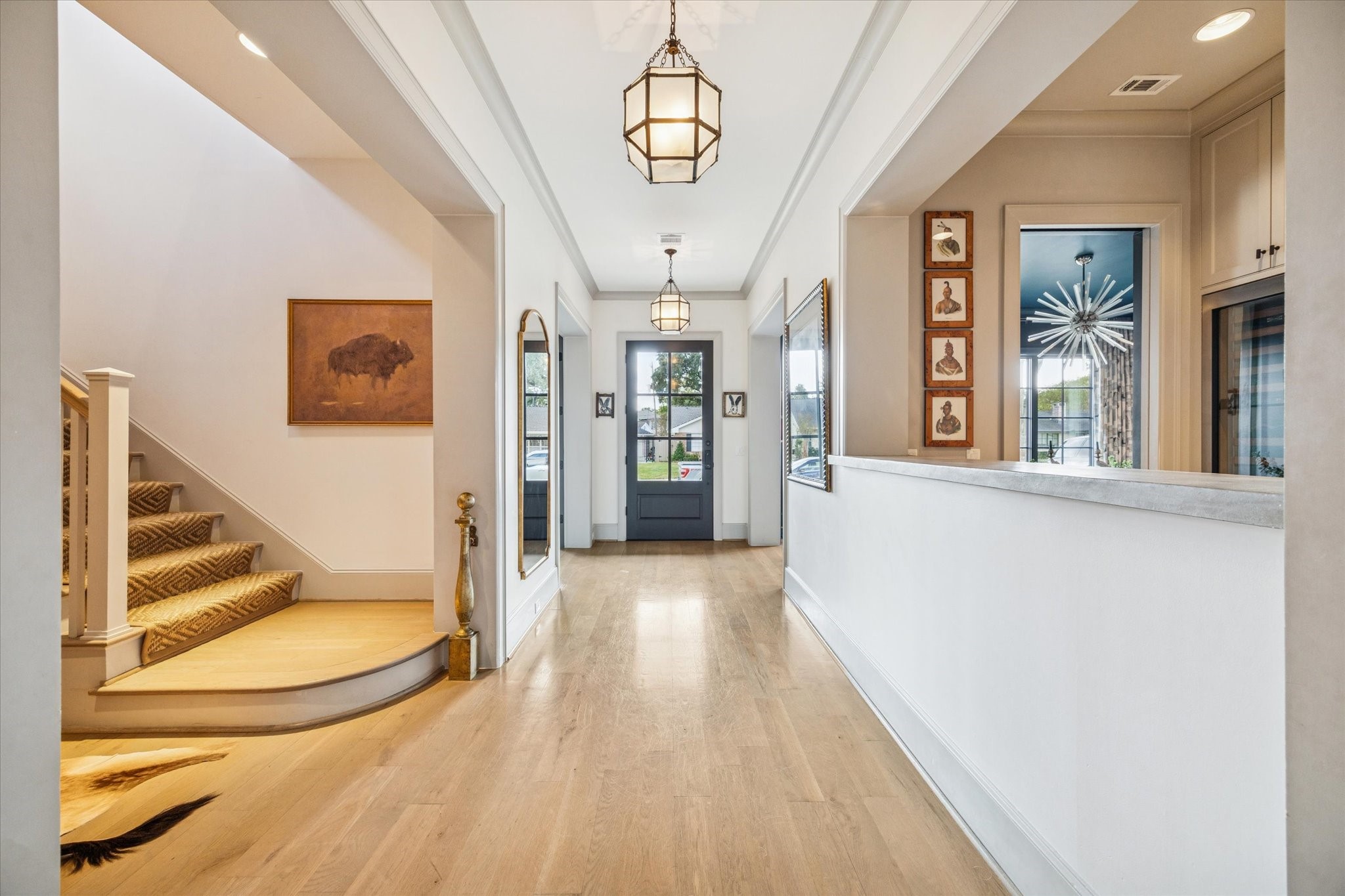 6218 Burgoyne Road Houston, TX 77057 - Photo 4 of 43 a view of a hallway with wooden floor and staircase