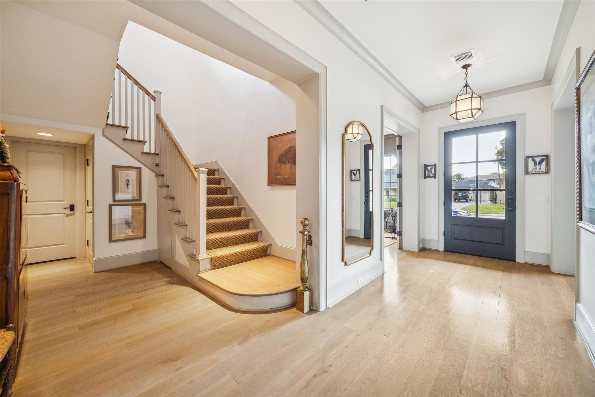 6218 Burgoyne Road Houston, TX 77057 - Photo 5 of 43 a view of a livingroom with wooden floor and stairs