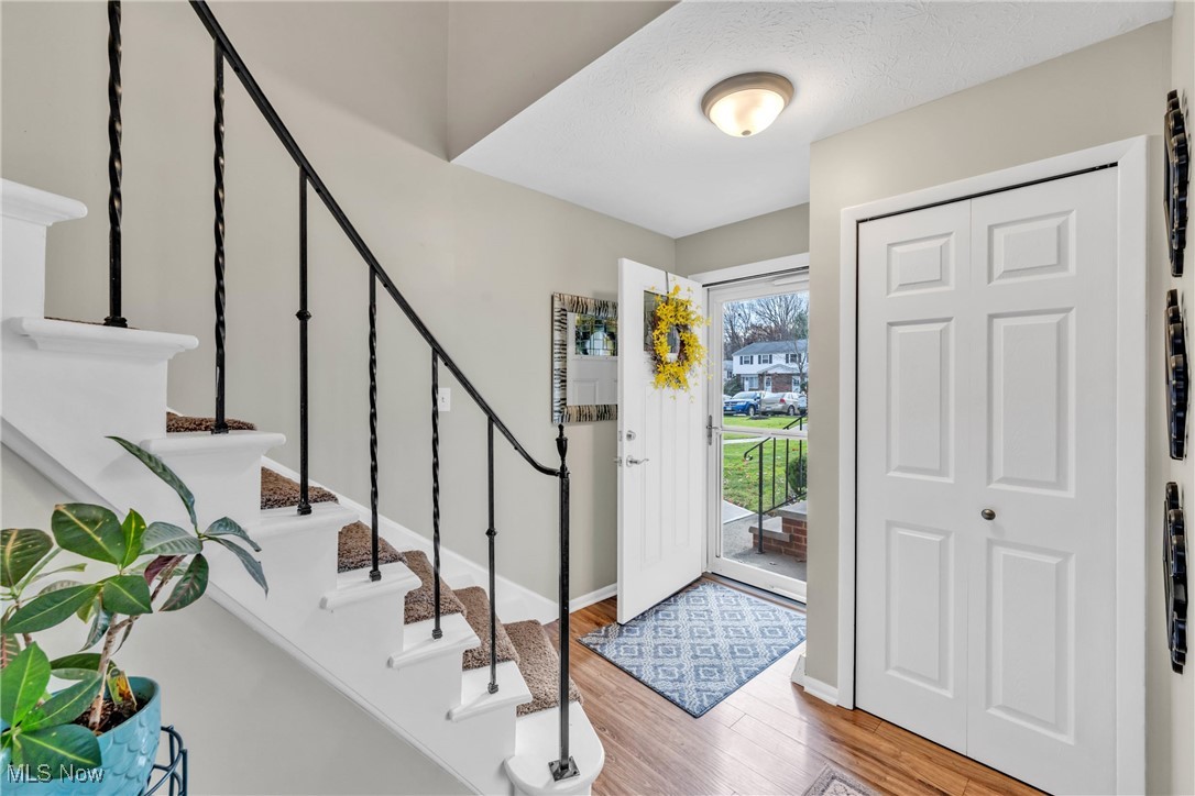 6486 State Road, Unit C5 Parma, OH 44134 - Photo 4 of 27 Entryway featuring light wood-type flooring and stairs
