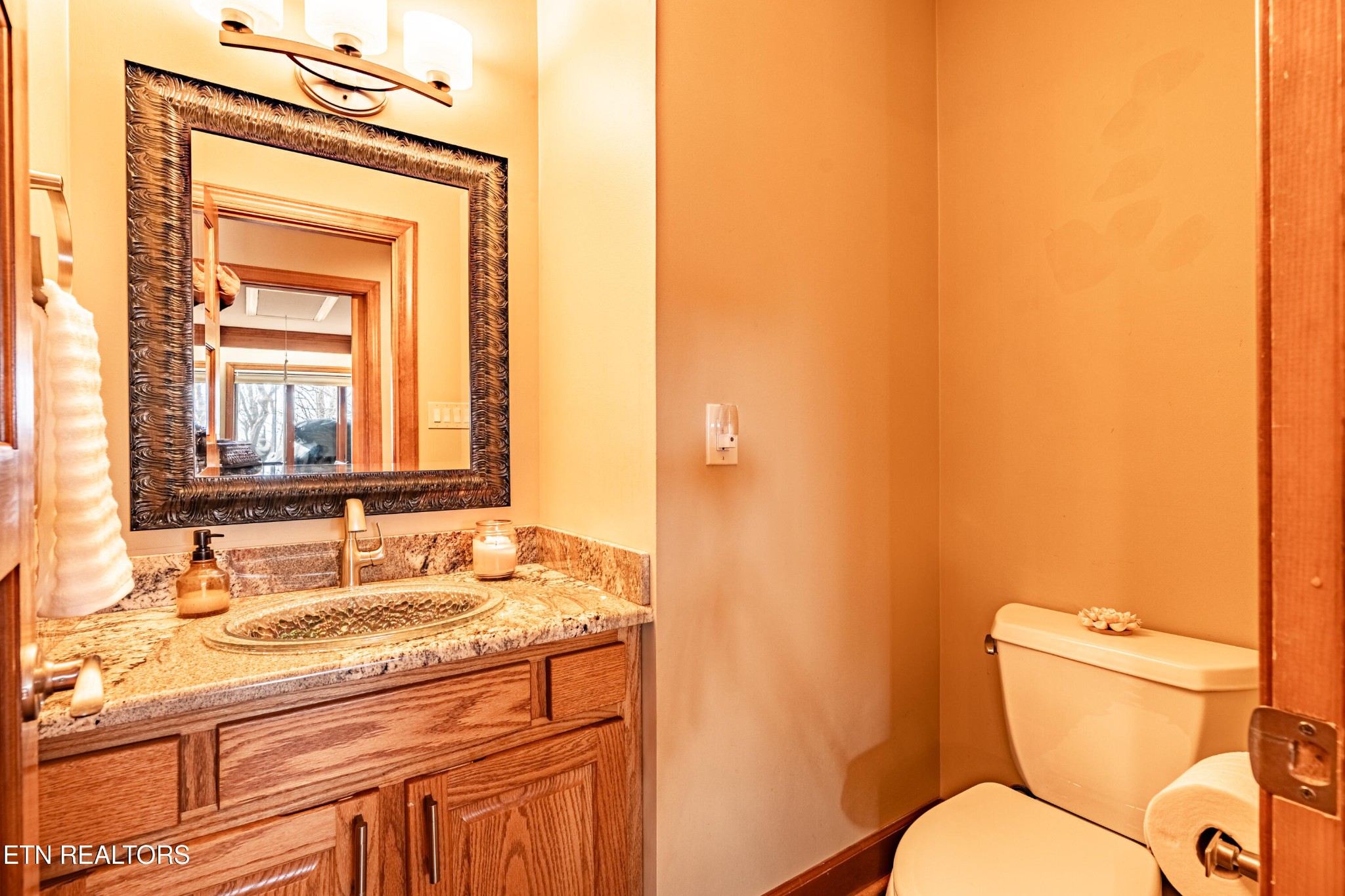 11104 Poplar Ridge Road Knoxville, TN 37932 - Photo 20 of 53 a bathroom with a granite countertop toilet sink and mirror