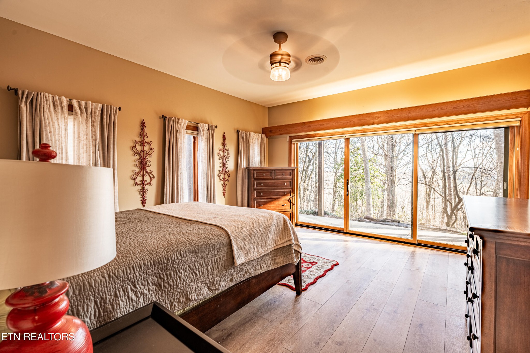 11104 Poplar Ridge Road Knoxville, TN 37932 - Photo 33 of 53 a bedroom with a large bed and a large window